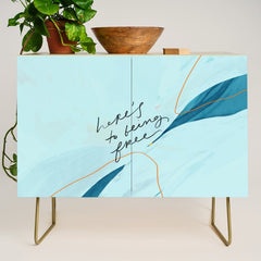 "Here's To Being Free." Credenza