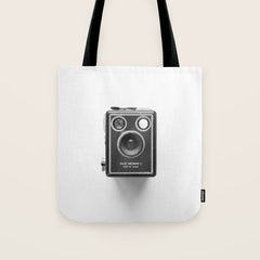 A Kodak Brownie analog vintage camera on a white background Retro photography in black and white Tote Bag
