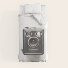 A Kodak Brownie analog vintage camera on a white background Retro photography in black and white Duvet Cover