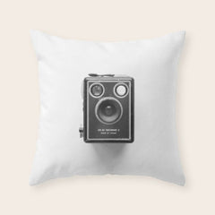 A Kodak Brownie analog vintage camera on a white background Retro photography in black and white Throw Pillow