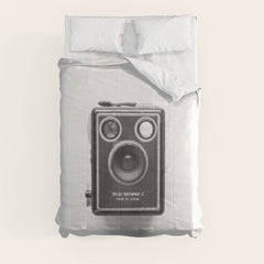A Kodak Brownie analog vintage camera on a white background Retro photography in black and white Comforter