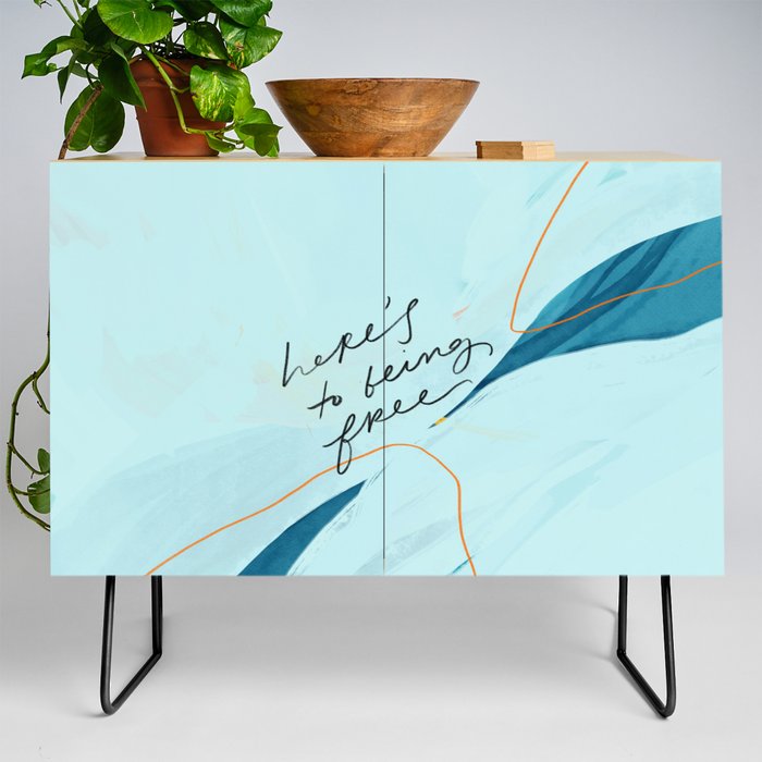 "Here's To Being Free." Credenza