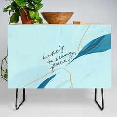 "Here's To Being Free." Credenza