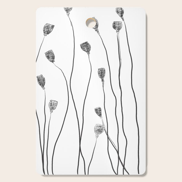 A group of poppy heads Cutting Board