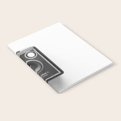 A Kodak Brownie analog vintage camera on a white background  Retro photography in black and white Notebook