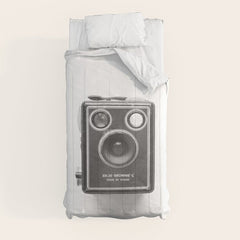 A Kodak Brownie analog vintage camera on a white background  Retro photography in black and white Comforter