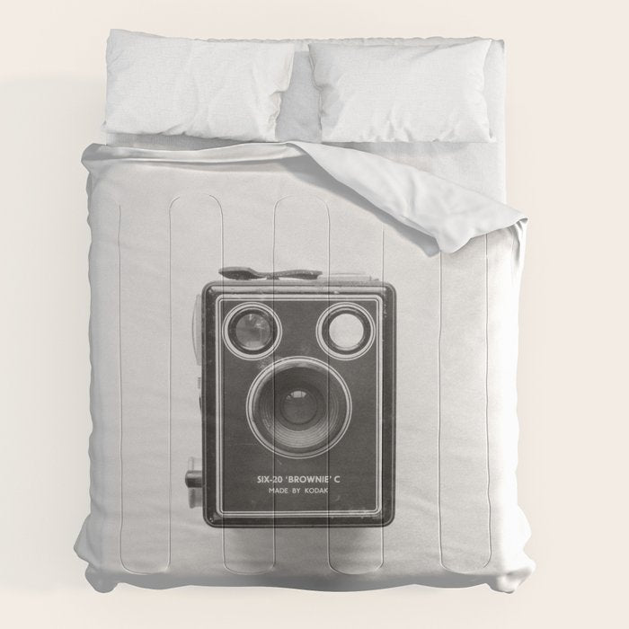 A Kodak Brownie analog vintage camera on a white background  Retro photography in black and white Comforter