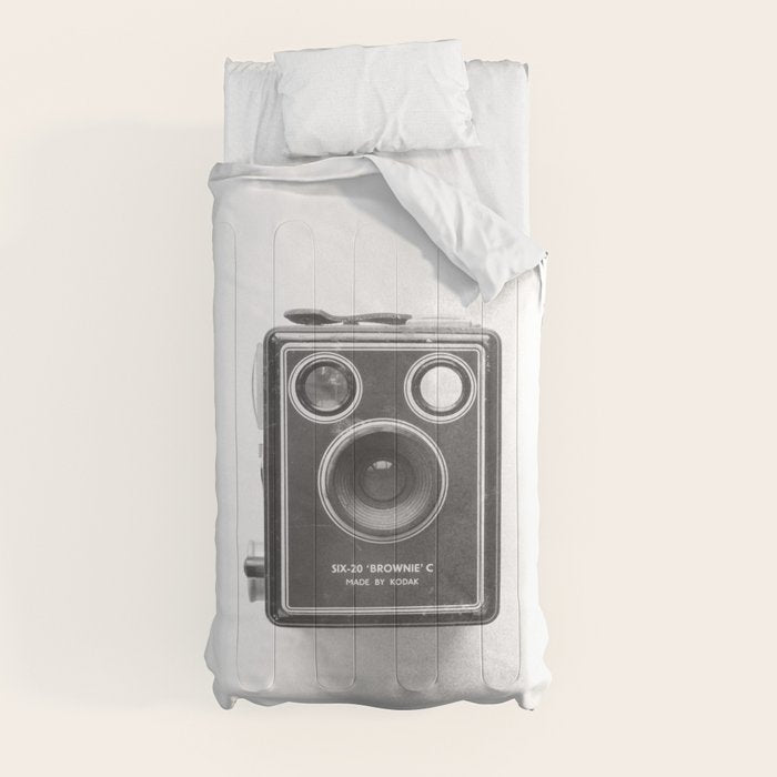 A Kodak Brownie analog vintage camera on a white background  Retro photography in black and white Comforter