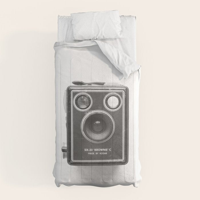 A Kodak Brownie analog vintage camera on a white background  Retro photography in black and white Comforter