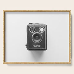A Kodak Brownie analog vintage camera on a white background  Retro photography in black and white Serving Tray