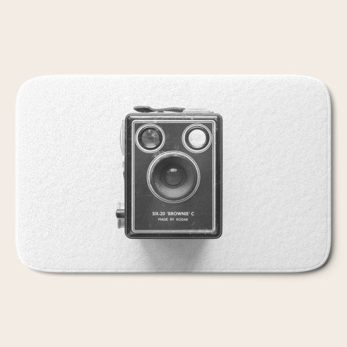 A Kodak Brownie analog vintage camera on a white background  Retro photography in black and white Bath Mat