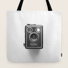 A Kodak Brownie analog vintage camera on a white background  Retro photography in black and white Tote Bag