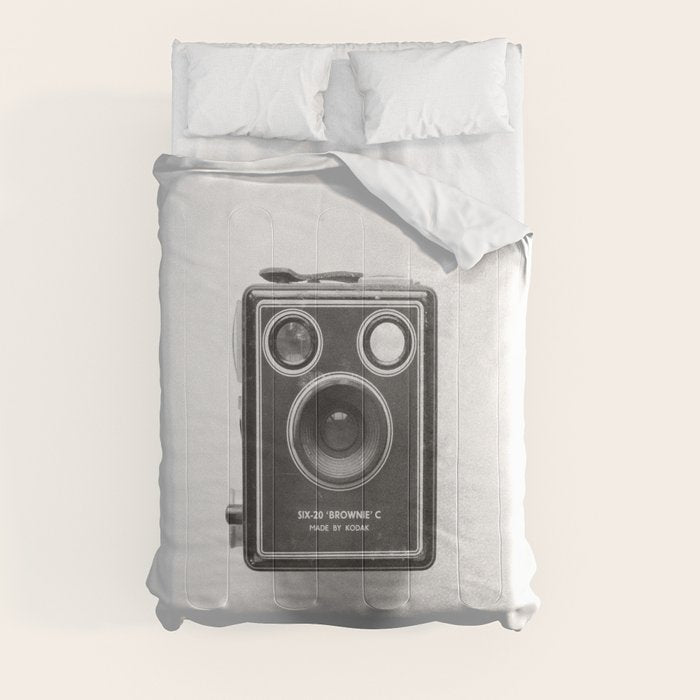A Kodak Brownie analog vintage camera on a white background  Retro photography in black and white Comforter