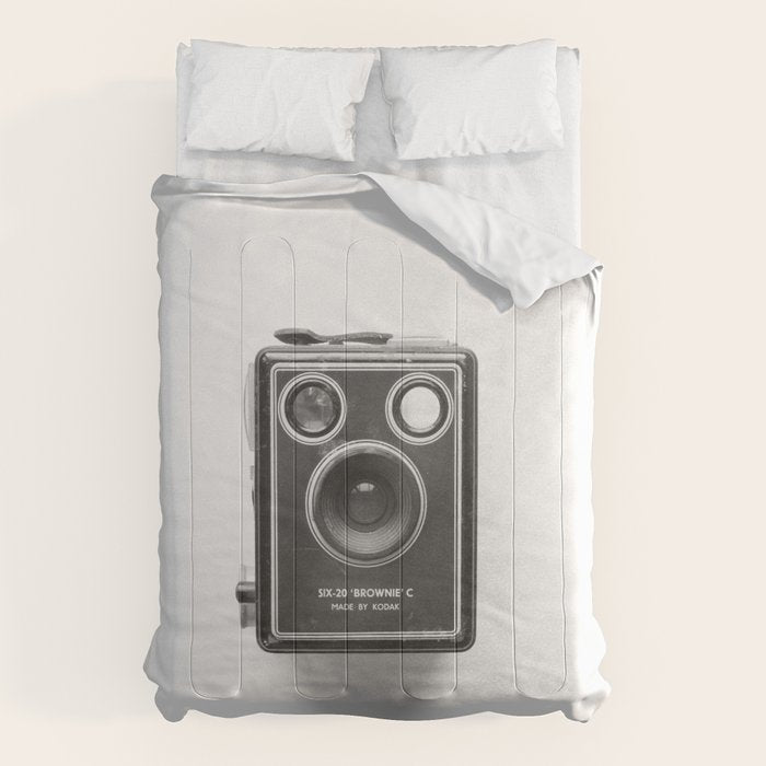 A Kodak Brownie analog vintage camera on a white background  Retro photography in black and white Comforter
