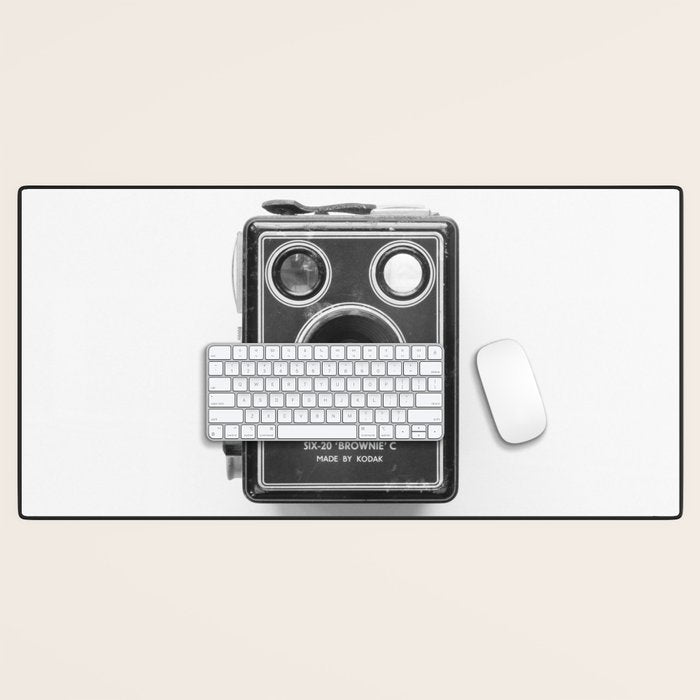 A Kodak Brownie analog vintage camera on a white background  Retro photography in black and white Desk Mat