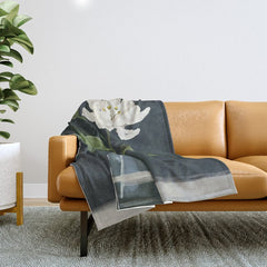 A flower in a vase Throw Blanket