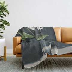 A flower in a vase Throw Blanket