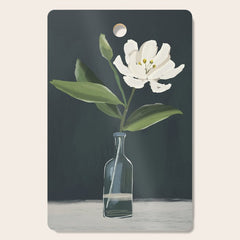 A flower in a vase Cutting Board