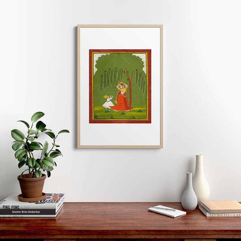 A female attendant is standing in tribhanga pose under a tree. A small child vies for her attention. Framed Art Print