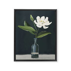A flower in a vase Framed Canvas Print
