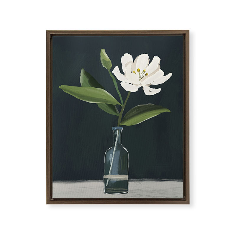 A flower in a vase Framed Canvas Print