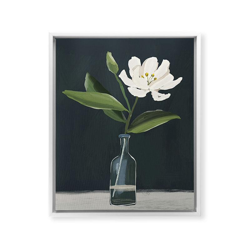A flower in a vase Framed Canvas Print